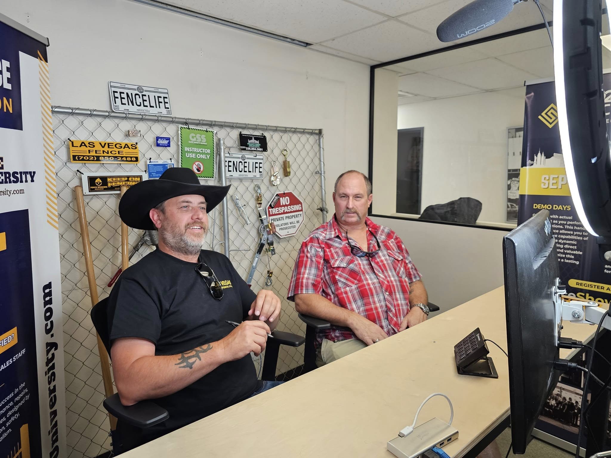 Brian interviewing a guest at the podcast desk