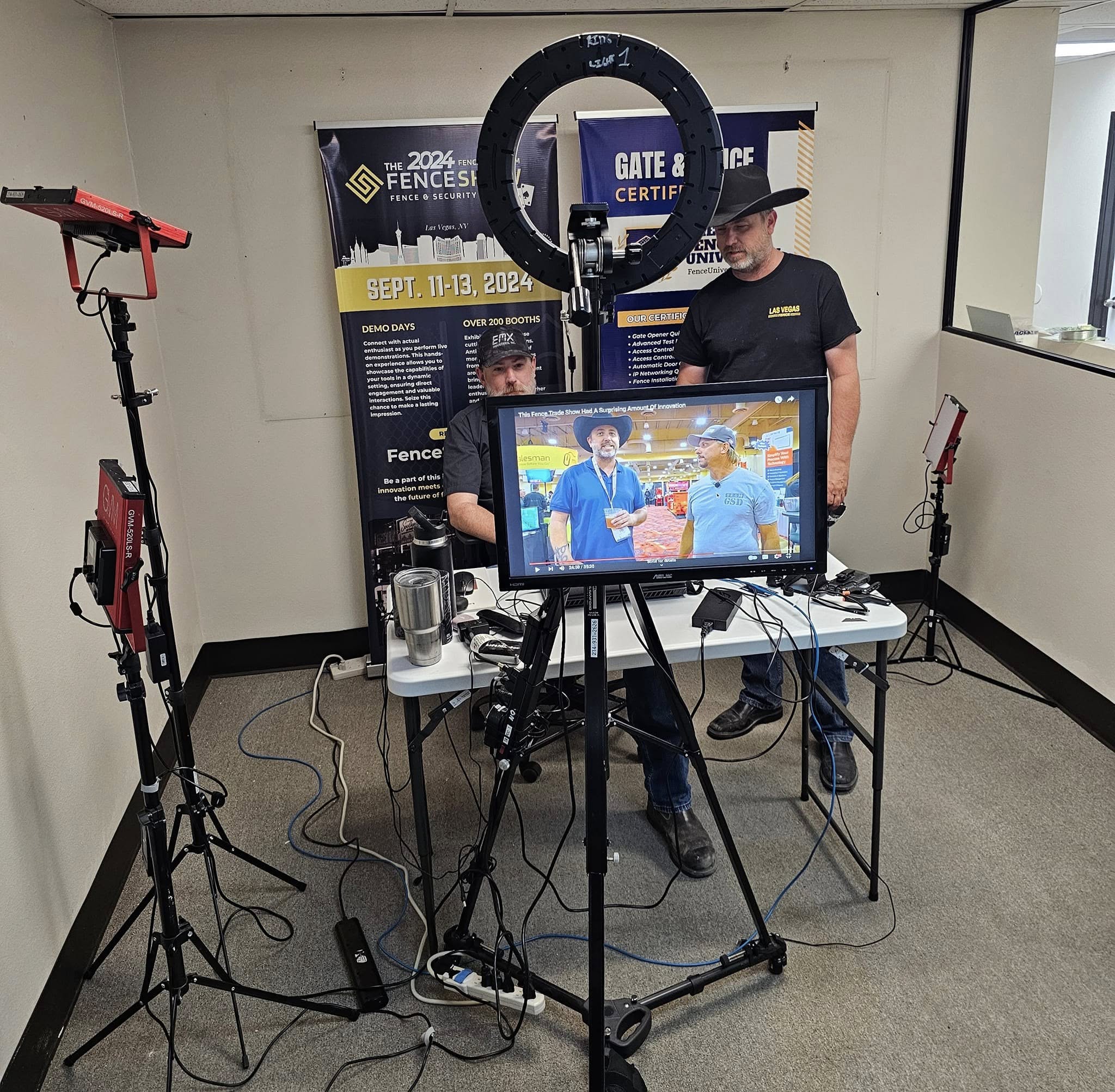 Full podcast production setup with monitors and lighting
